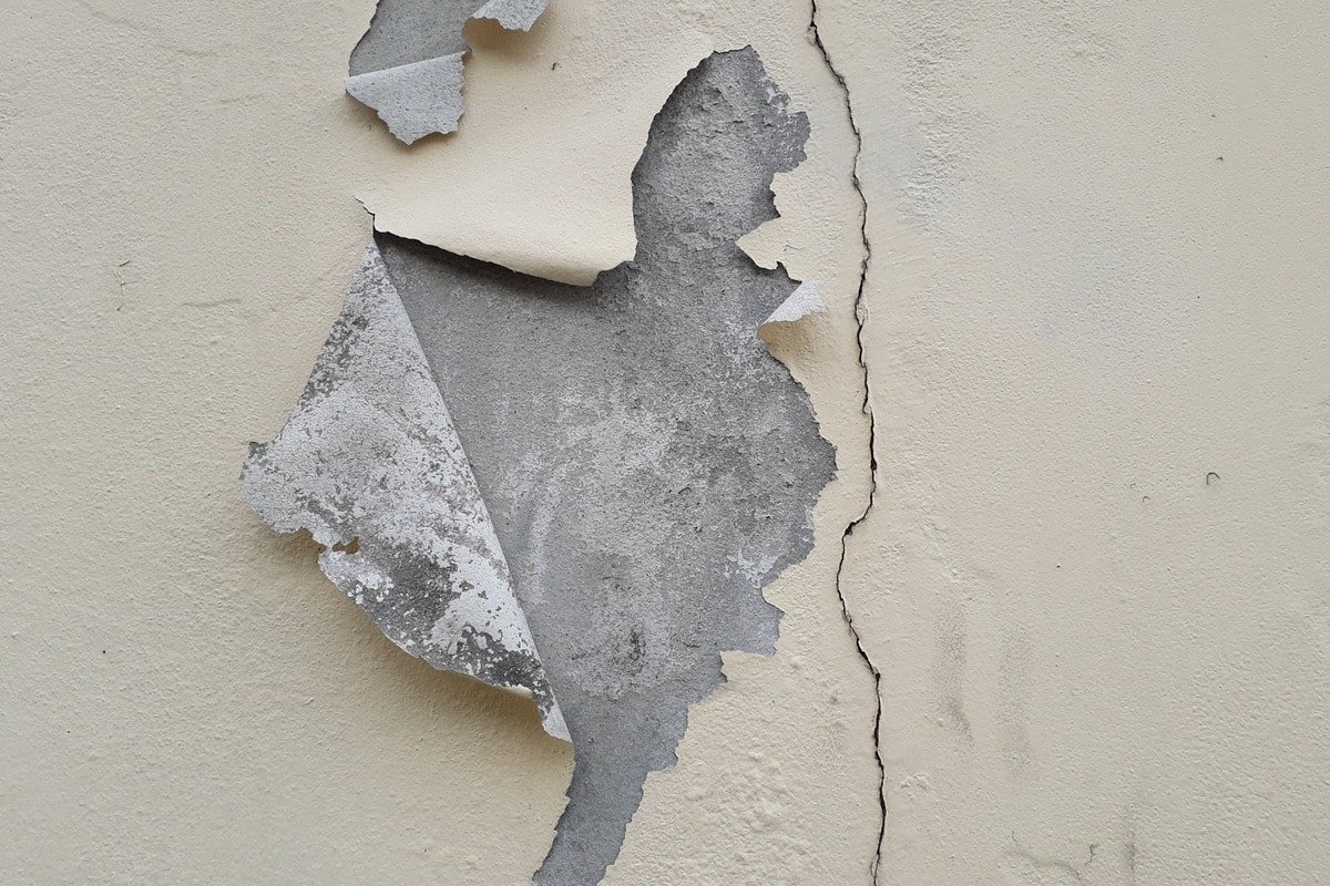Paint peeling plaster walls old.